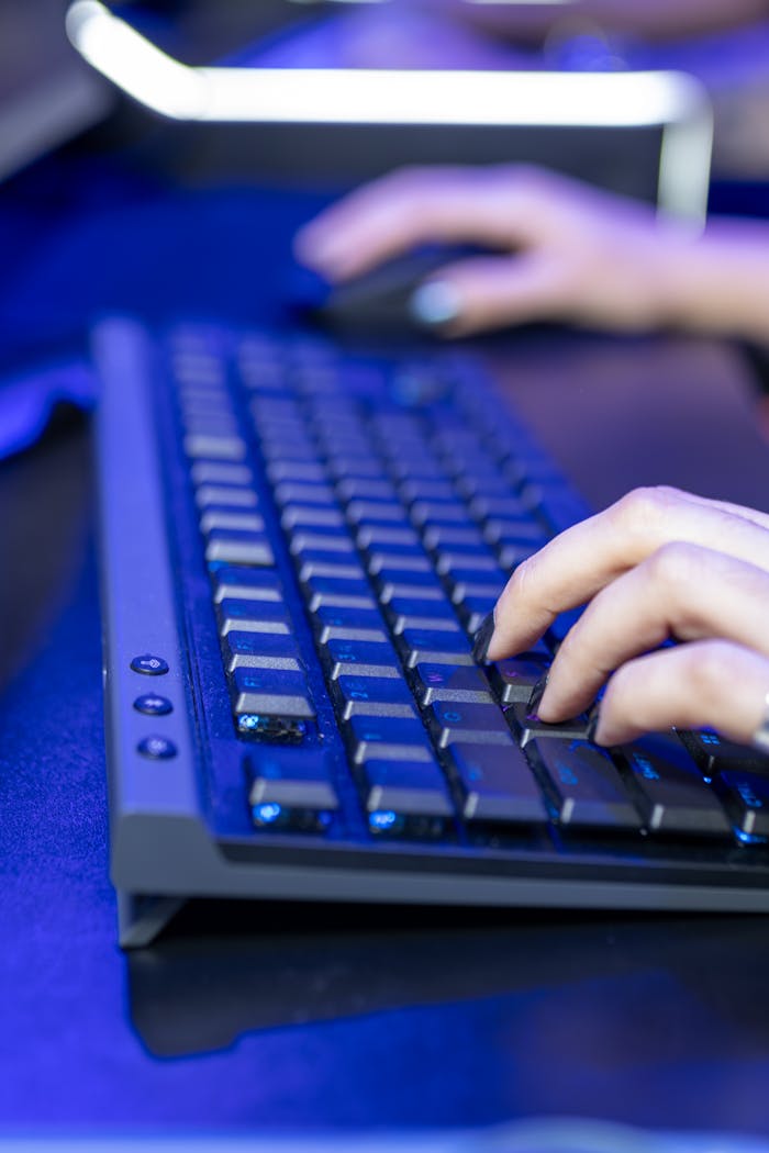 Close-up of Hands Typing on a Computer Keyboard